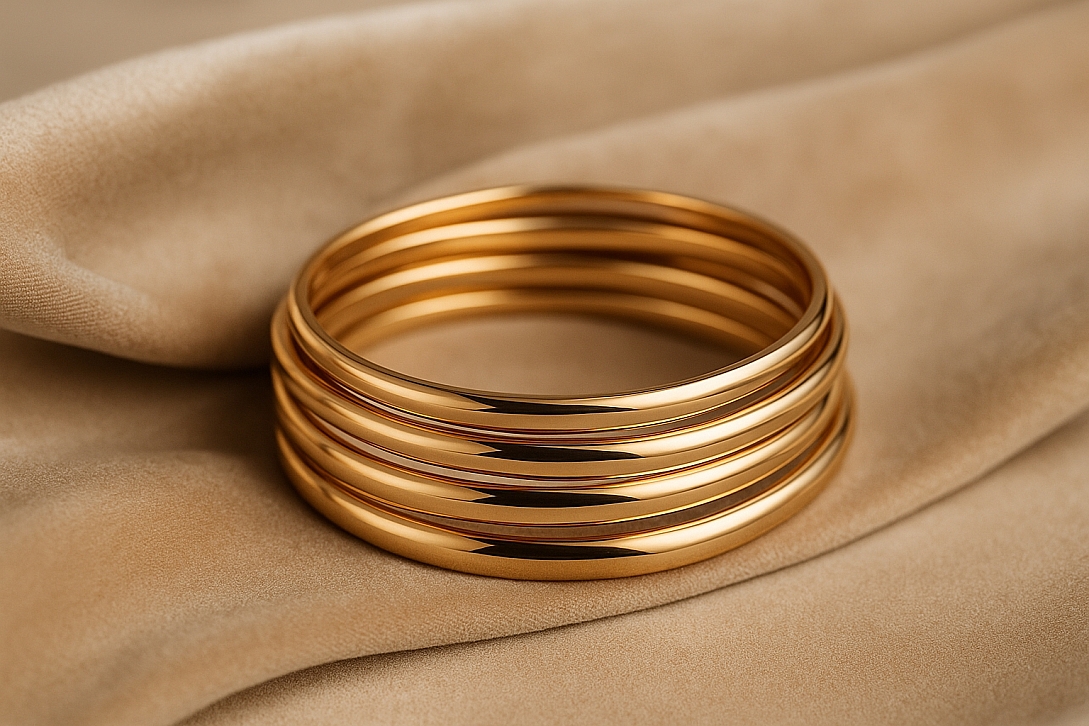 gold bangles on velvet fabric